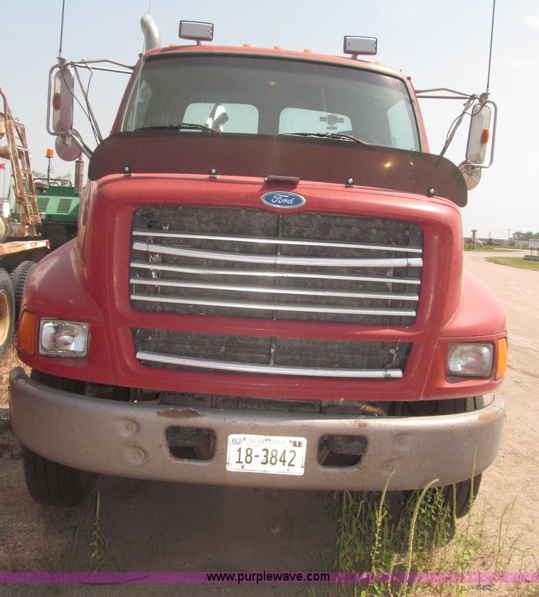 image for item F7088 1997 Ford LT9513 Louisville 113 triple axle semi truck