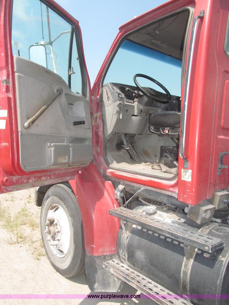 image for item F7088 1997 Ford LT9513 Louisville 113 triple axle semi truck