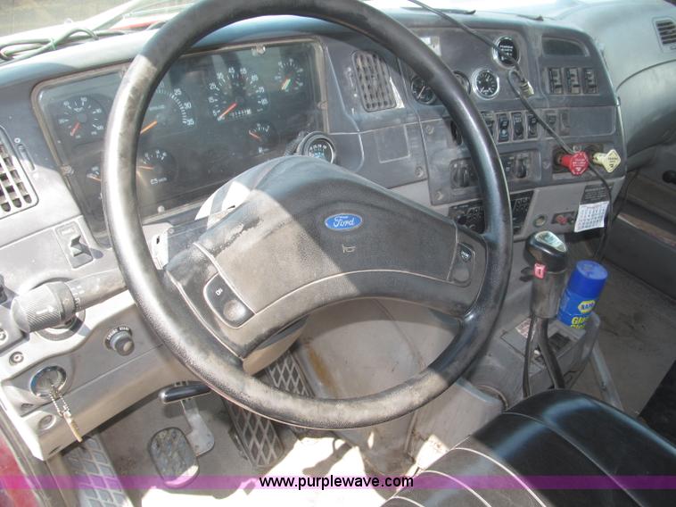 image for item F7088 1997 Ford LT9513 Louisville 113 triple axle semi truck