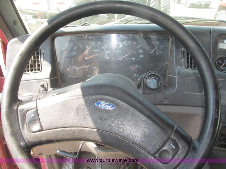 image for item F7088 1997 Ford LT9513 Louisville 113 triple axle semi truck