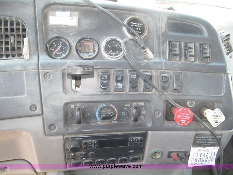 image for item F7088 1997 Ford LT9513 Louisville 113 triple axle semi truck