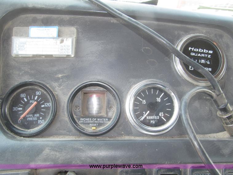 image for item F7088 1997 Ford LT9513 Louisville 113 triple axle semi truck