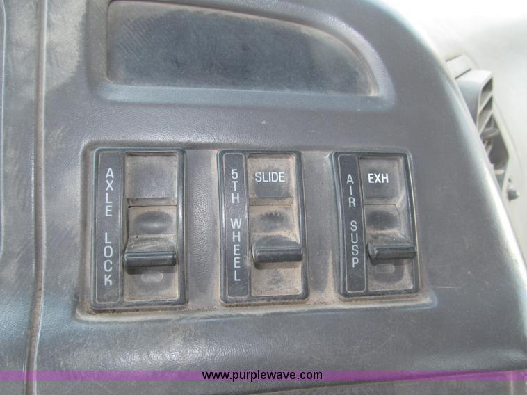 image for item F7088 1997 Ford LT9513 Louisville 113 triple axle semi truck