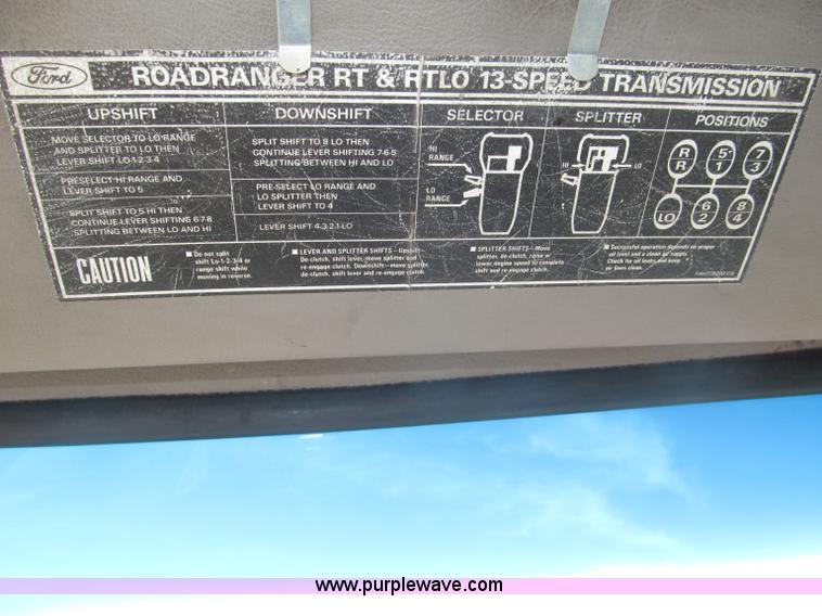 image for item F7088 1997 Ford LT9513 Louisville 113 triple axle semi truck