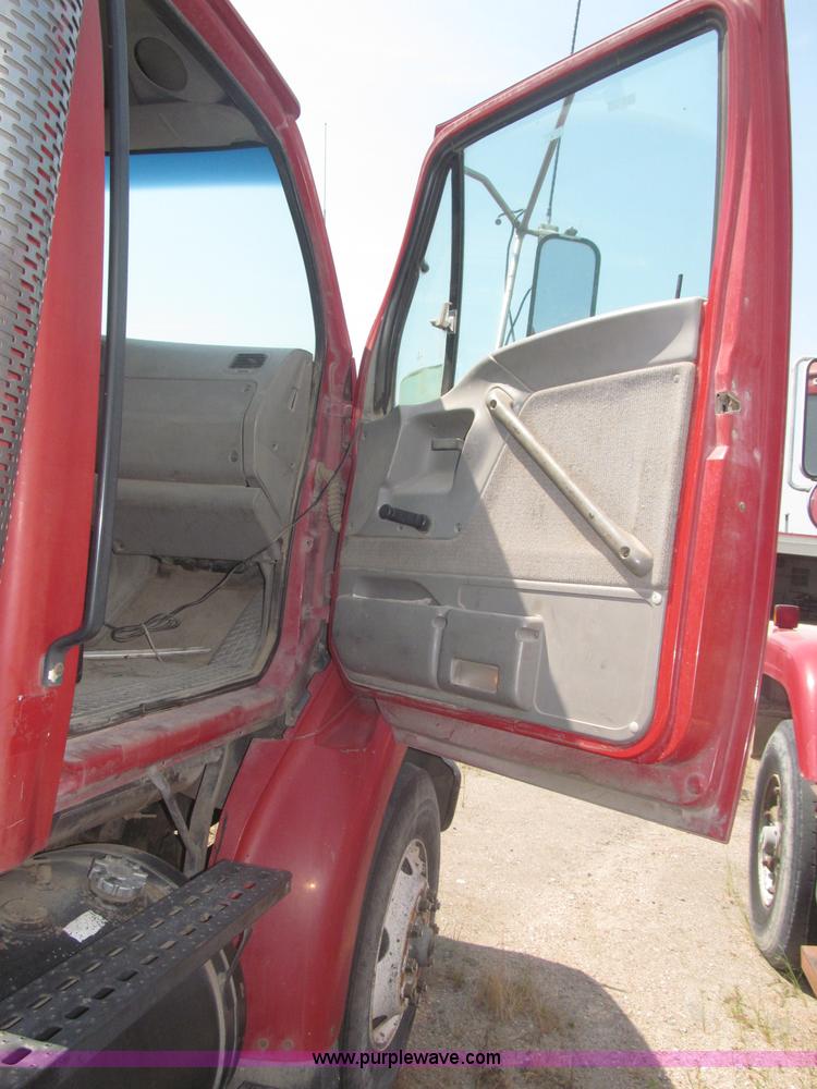 image for item F7088 1997 Ford LT9513 Louisville 113 triple axle semi truck