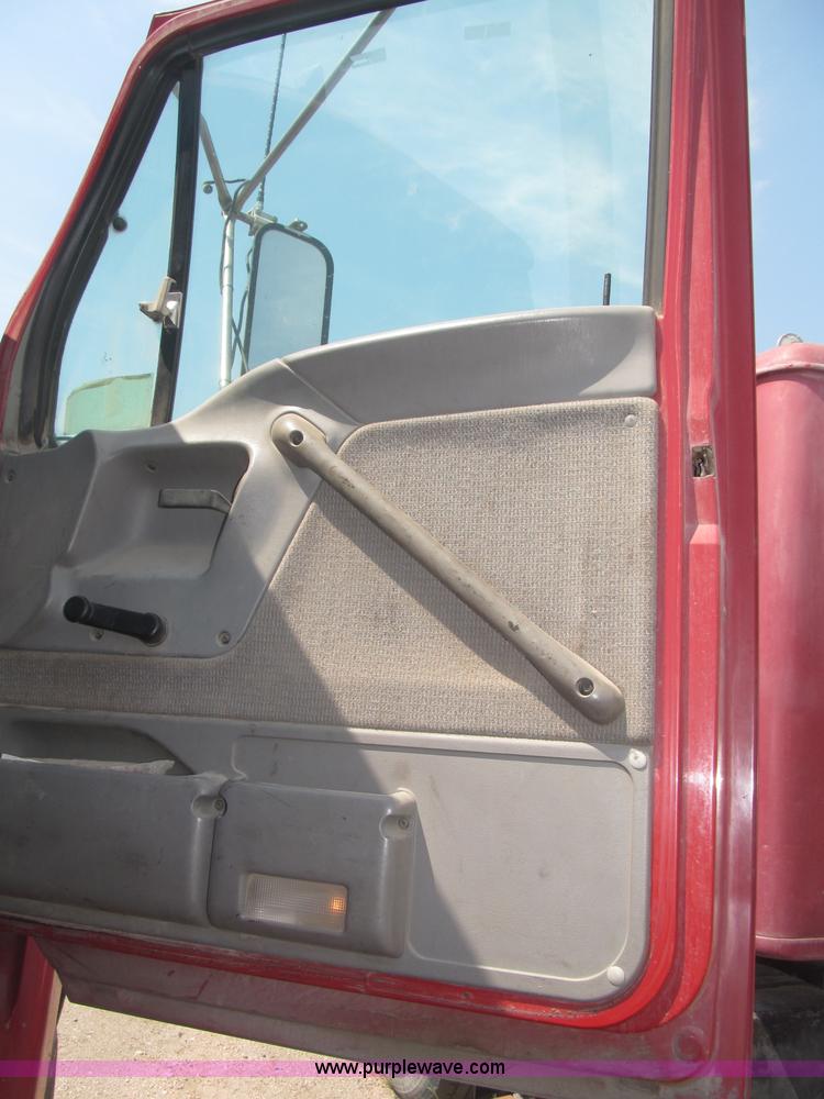 image for item F7088 1997 Ford LT9513 Louisville 113 triple axle semi truck