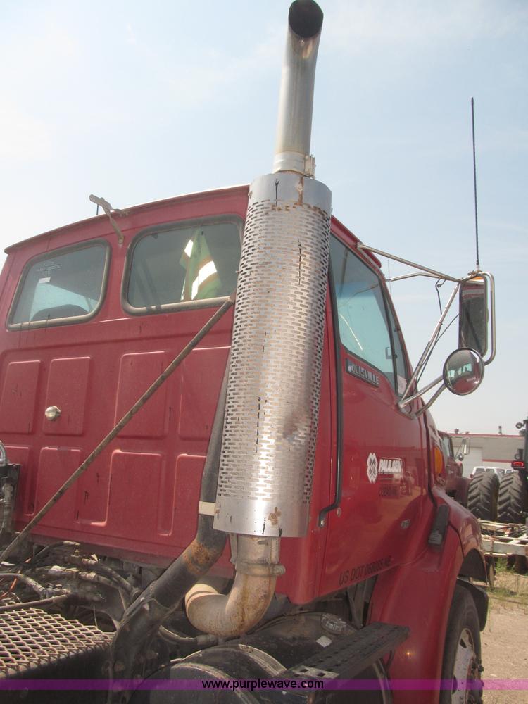 image for item F7088 1997 Ford LT9513 Louisville 113 triple axle semi truck