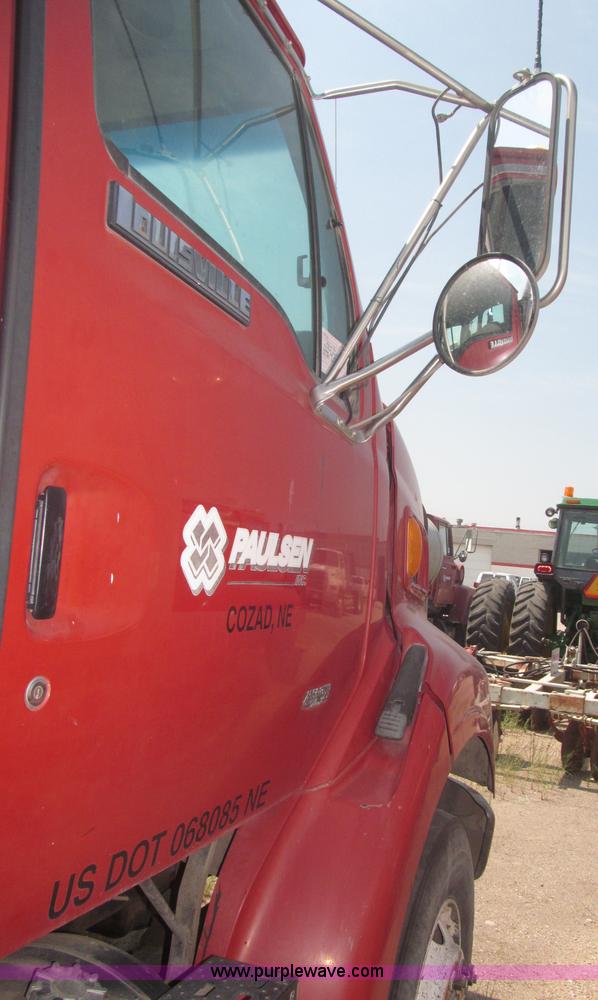 image for item F7088 1997 Ford LT9513 Louisville 113 triple axle semi truck