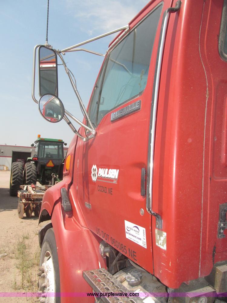 image for item F7088 1997 Ford LT9513 Louisville 113 triple axle semi truck