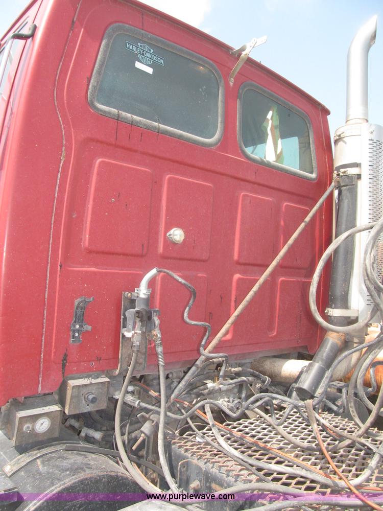 image for item F7088 1997 Ford LT9513 Louisville 113 triple axle semi truck