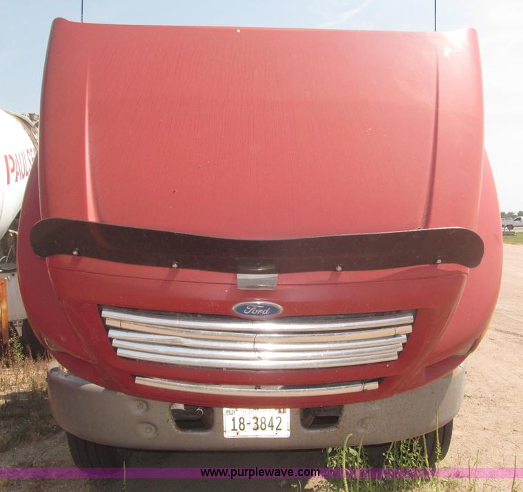 image for item F7088 1997 Ford LT9513 Louisville 113 triple axle semi truck