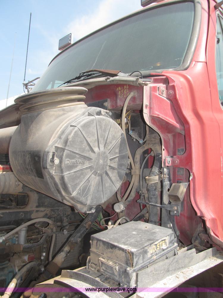 image for item F7088 1997 Ford LT9513 Louisville 113 triple axle semi truck