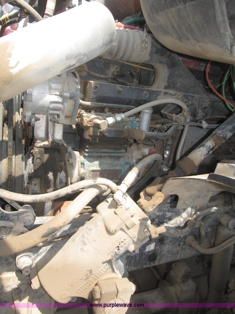 image for item F7088 1997 Ford LT9513 Louisville 113 triple axle semi truck