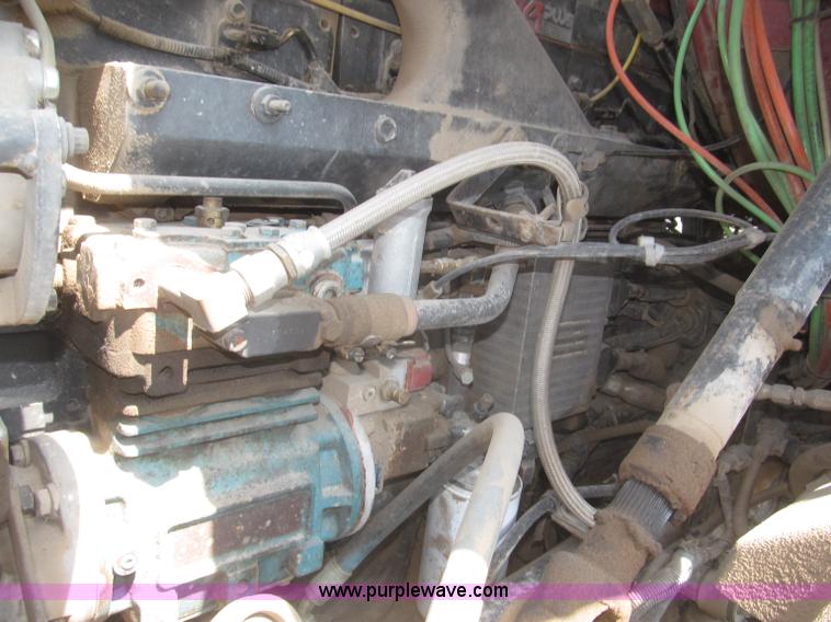 image for item F7088 1997 Ford LT9513 Louisville 113 triple axle semi truck