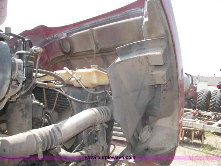 image for item F7088 1997 Ford LT9513 Louisville 113 triple axle semi truck