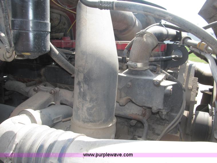 image for item F7088 1997 Ford LT9513 Louisville 113 triple axle semi truck