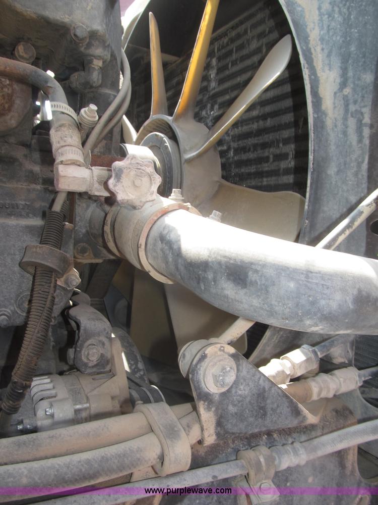 image for item F7088 1997 Ford LT9513 Louisville 113 triple axle semi truck