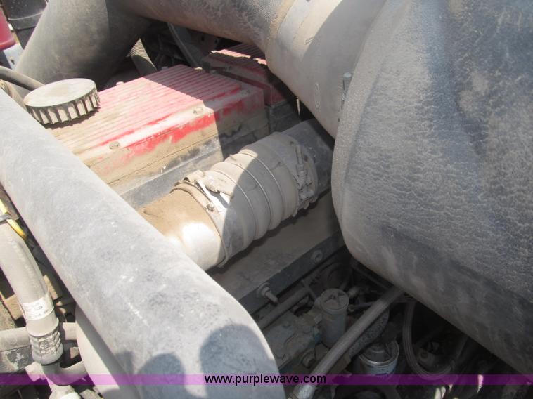 image for item F7088 1997 Ford LT9513 Louisville 113 triple axle semi truck