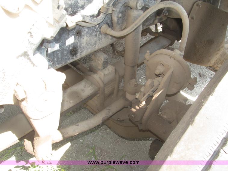 image for item F7088 1997 Ford LT9513 Louisville 113 triple axle semi truck