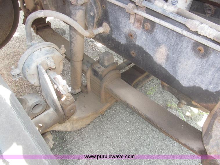 image for item F7088 1997 Ford LT9513 Louisville 113 triple axle semi truck