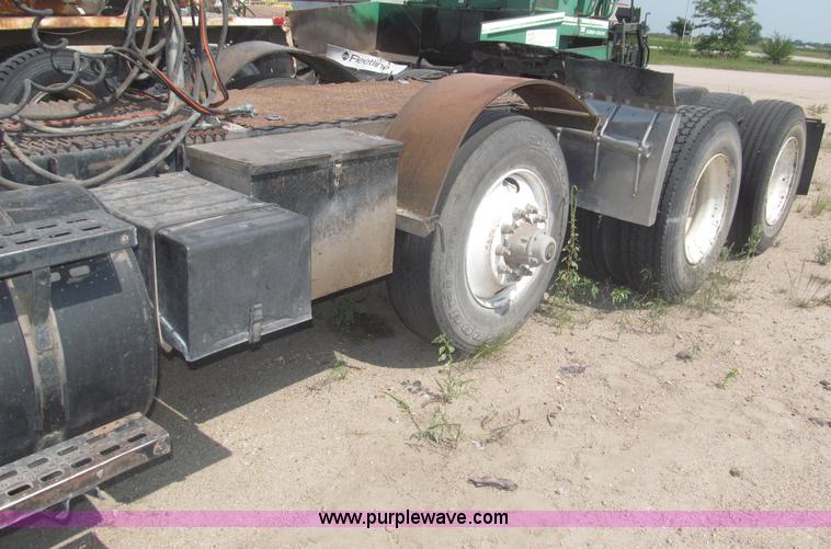 image for item F7088 1997 Ford LT9513 Louisville 113 triple axle semi truck