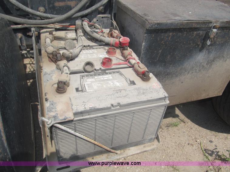 image for item F7088 1997 Ford LT9513 Louisville 113 triple axle semi truck