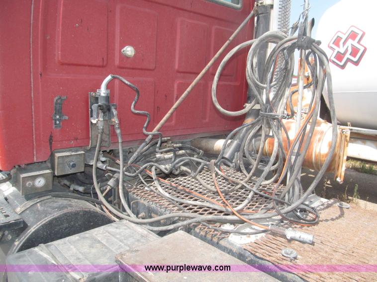 image for item F7088 1997 Ford LT9513 Louisville 113 triple axle semi truck