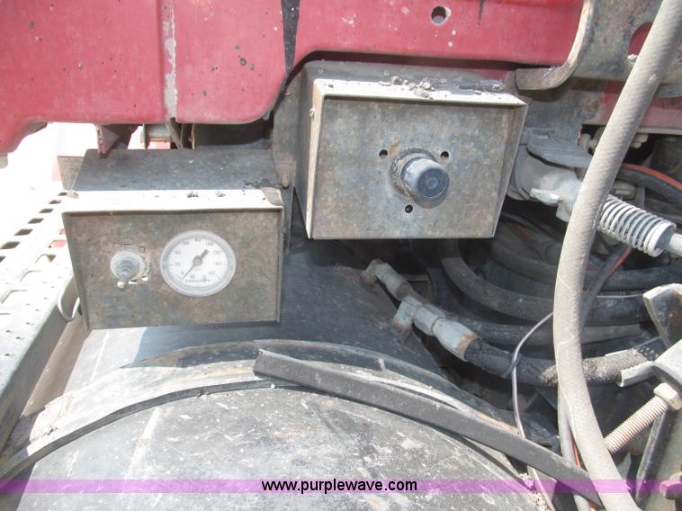 image for item F7088 1997 Ford LT9513 Louisville 113 triple axle semi truck