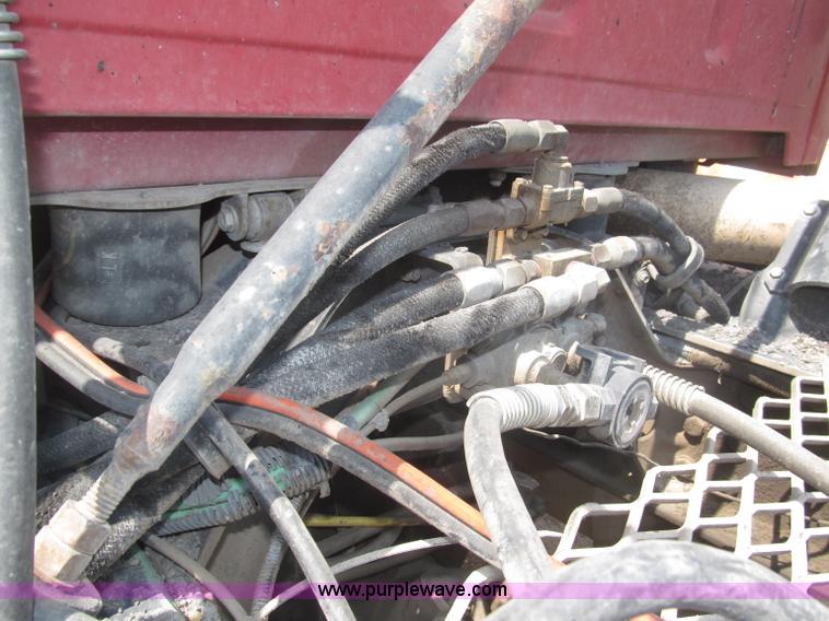 image for item F7088 1997 Ford LT9513 Louisville 113 triple axle semi truck