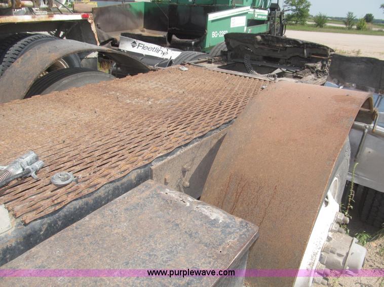 image for item F7088 1997 Ford LT9513 Louisville 113 triple axle semi truck