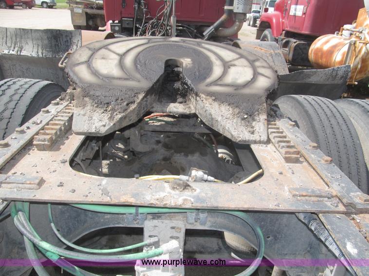 image for item F7088 1997 Ford LT9513 Louisville 113 triple axle semi truck