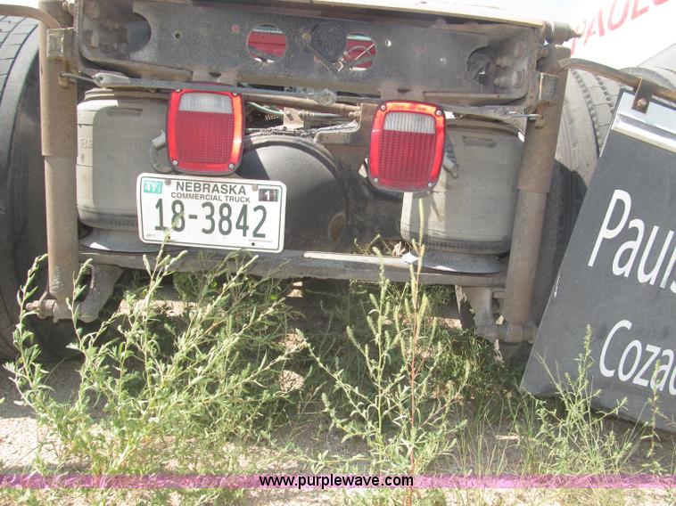 image for item F7088 1997 Ford LT9513 Louisville 113 triple axle semi truck