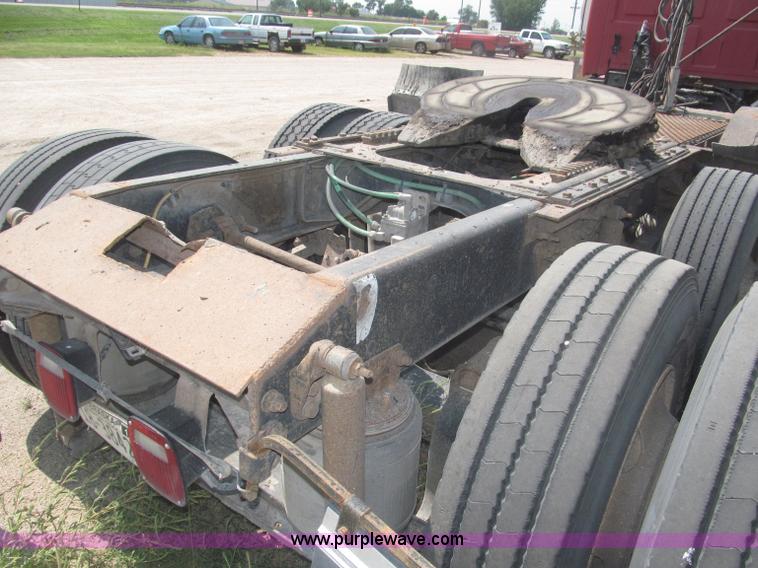 image for item F7088 1997 Ford LT9513 Louisville 113 triple axle semi truck