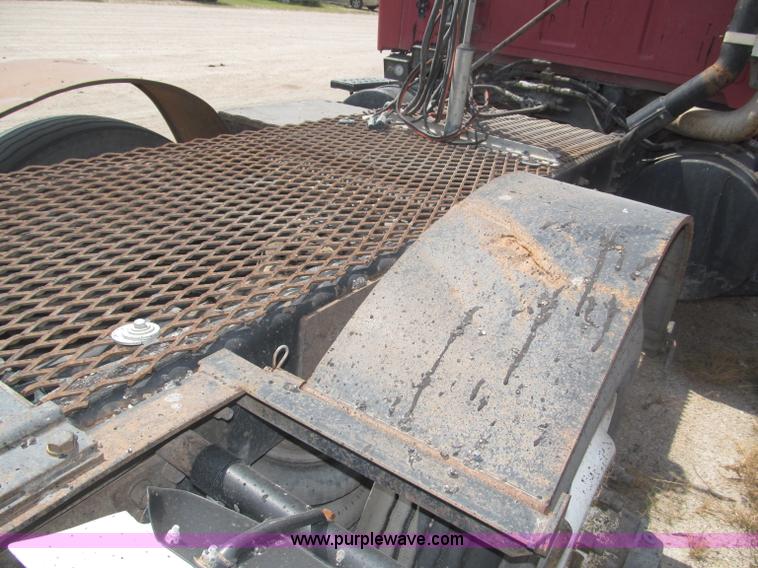 image for item F7088 1997 Ford LT9513 Louisville 113 triple axle semi truck