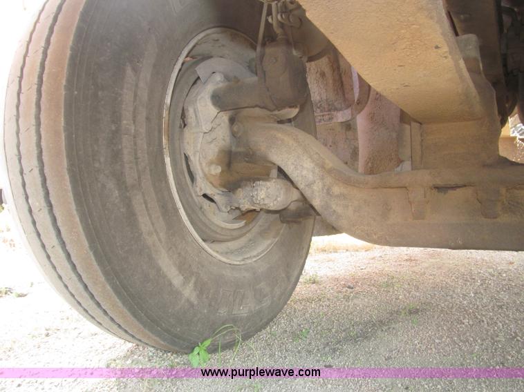 image for item F7088 1997 Ford LT9513 Louisville 113 triple axle semi truck