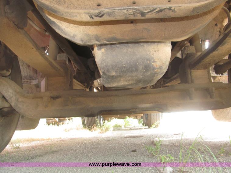 image for item F7088 1997 Ford LT9513 Louisville 113 triple axle semi truck