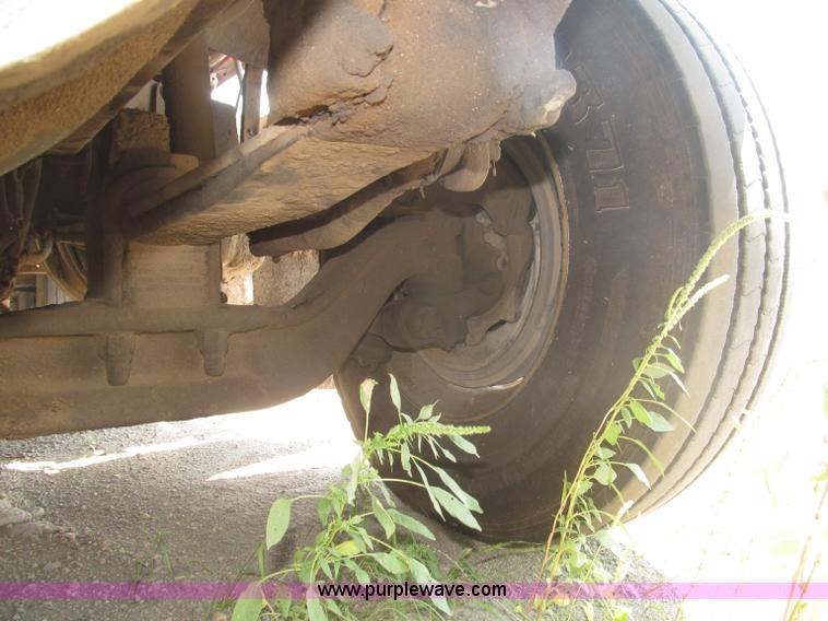 image for item F7088 1997 Ford LT9513 Louisville 113 triple axle semi truck