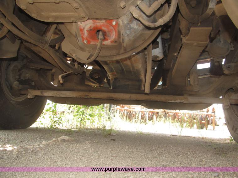 image for item F7088 1997 Ford LT9513 Louisville 113 triple axle semi truck