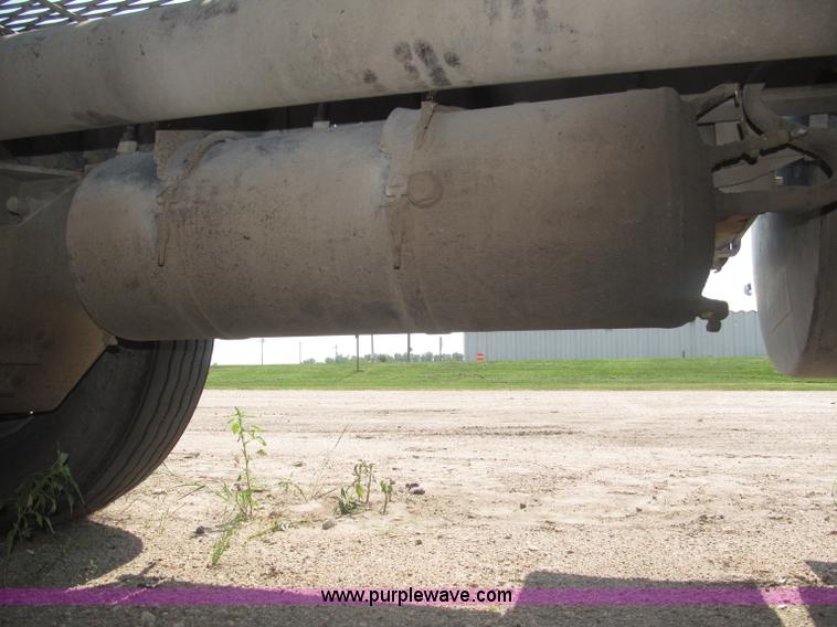 image for item F7088 1997 Ford LT9513 Louisville 113 triple axle semi truck