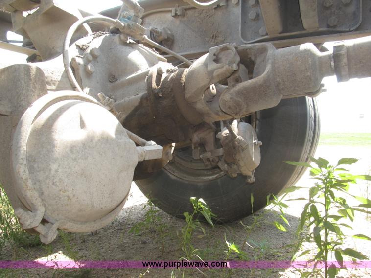 image for item F7088 1997 Ford LT9513 Louisville 113 triple axle semi truck