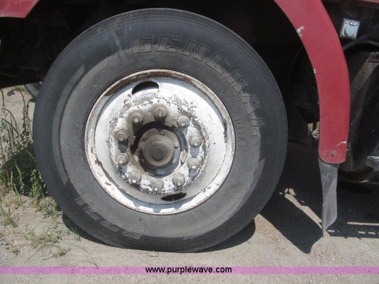 image for item F7088 1997 Ford LT9513 Louisville 113 triple axle semi truck