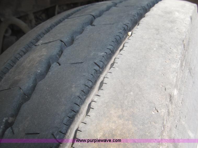 image for item F7088 1997 Ford LT9513 Louisville 113 triple axle semi truck