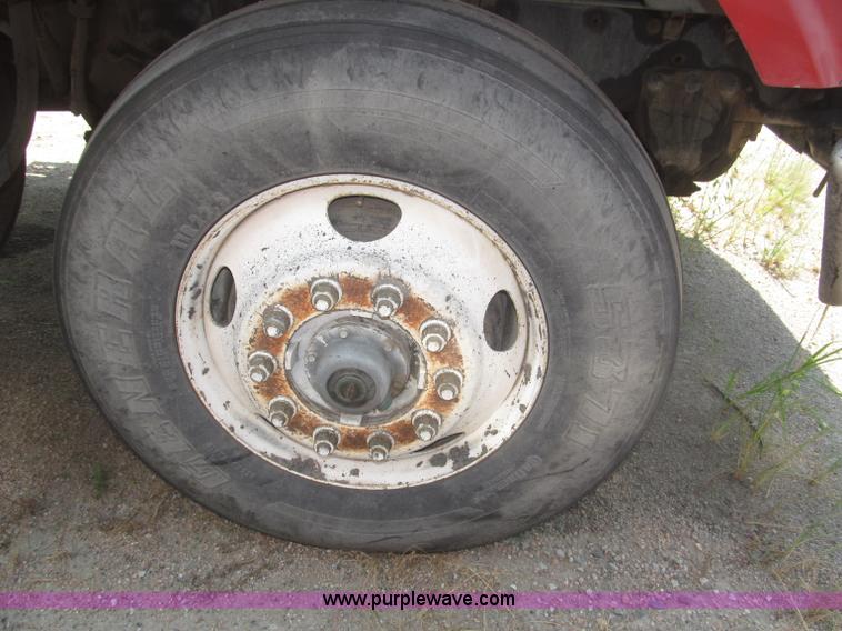 image for item F7088 1997 Ford LT9513 Louisville 113 triple axle semi truck