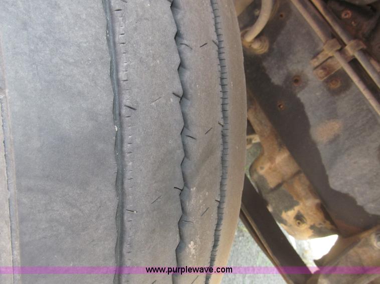 image for item F7088 1997 Ford LT9513 Louisville 113 triple axle semi truck