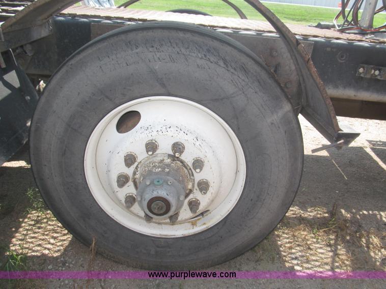 image for item F7088 1997 Ford LT9513 Louisville 113 triple axle semi truck