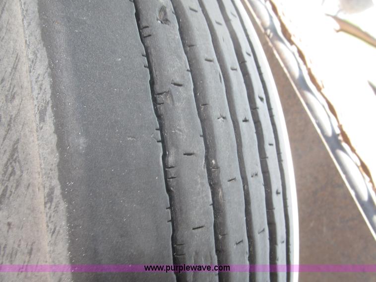 image for item F7088 1997 Ford LT9513 Louisville 113 triple axle semi truck