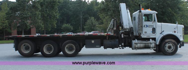 image for item I7757 2002 Freightliner FLD120SD triple axle semi truck with Palfinger knuckle boom crane