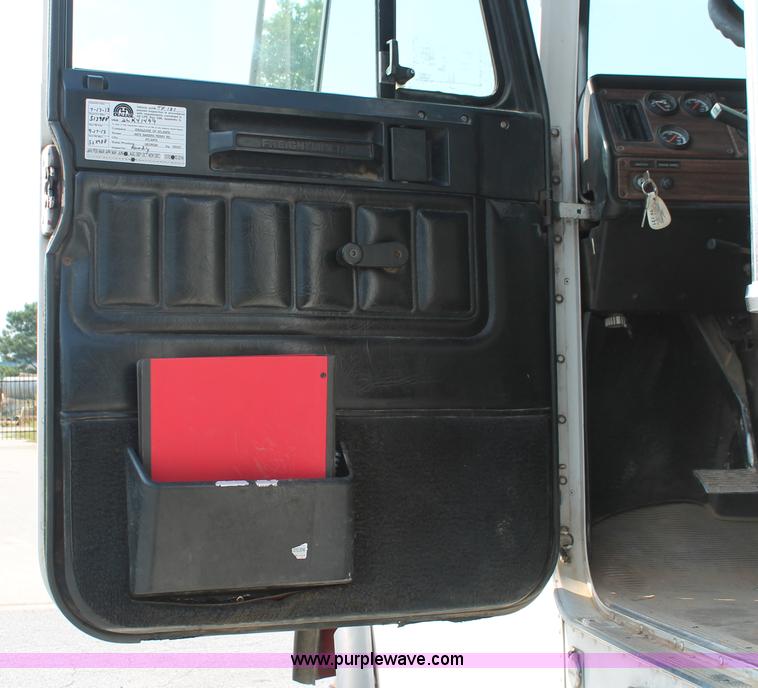 image for item I7757 2002 Freightliner FLD120SD triple axle semi truck with Palfinger knuckle boom crane