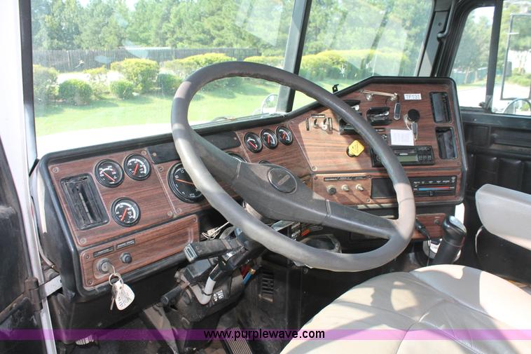 image for item I7757 2002 Freightliner FLD120SD triple axle semi truck with Palfinger knuckle boom crane