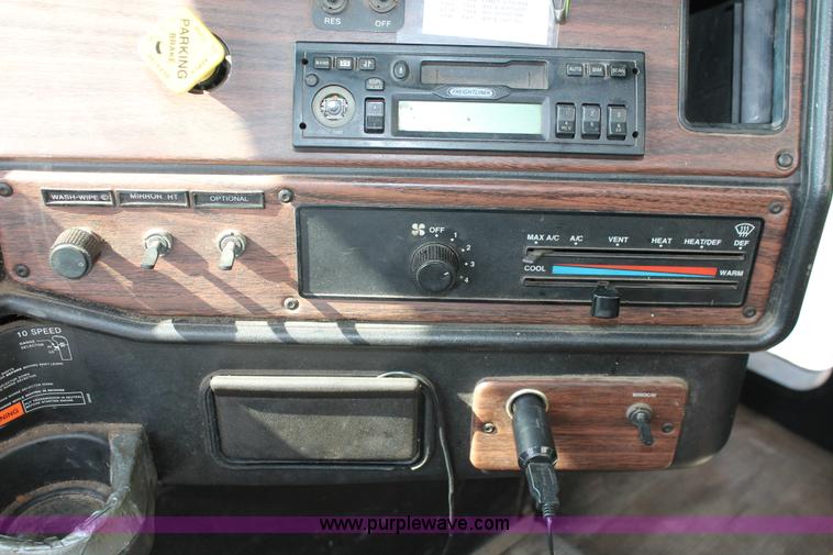 image for item I7757 2002 Freightliner FLD120SD triple axle semi truck with Palfinger knuckle boom crane